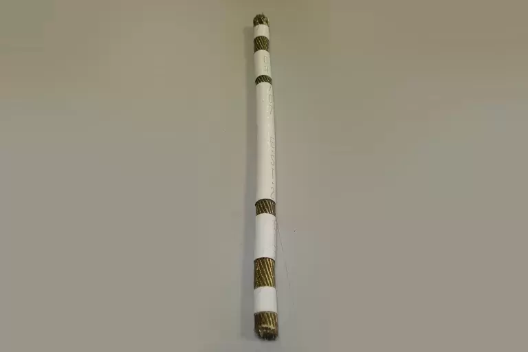 04707 EST 2 white colored wrapper for golden wire.